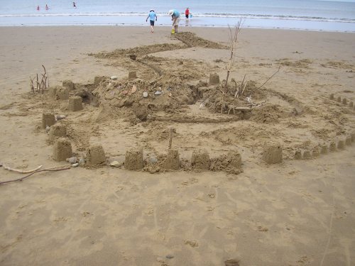 I'm a wife, I'm a mother, I'm an author, I'm a housekeeper, I'm an occasional educator, I'm a radio co-host, and I'm an ACE SANDCASTLE BUILDER! Although to be fair, this was a whole-family project and it took nearly all day to complete... just in time for the tide to wash it all away!