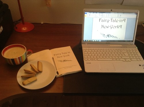 Essential proofing tools: Irish cream latte; biscuits; laptop; the annotated print proof; and Christmas rock songs (which sadly I can't show you!) :-)